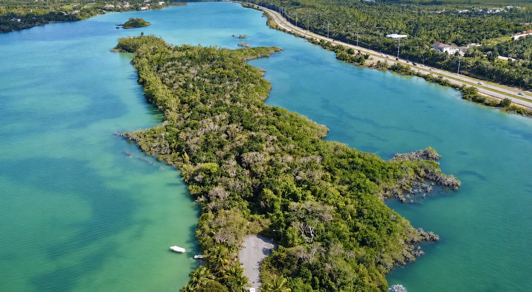 Looking along the wooded peninsula, surrounded by turquoise water